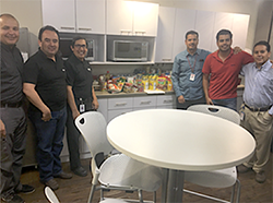 Ciena volunteers standing in breakroom