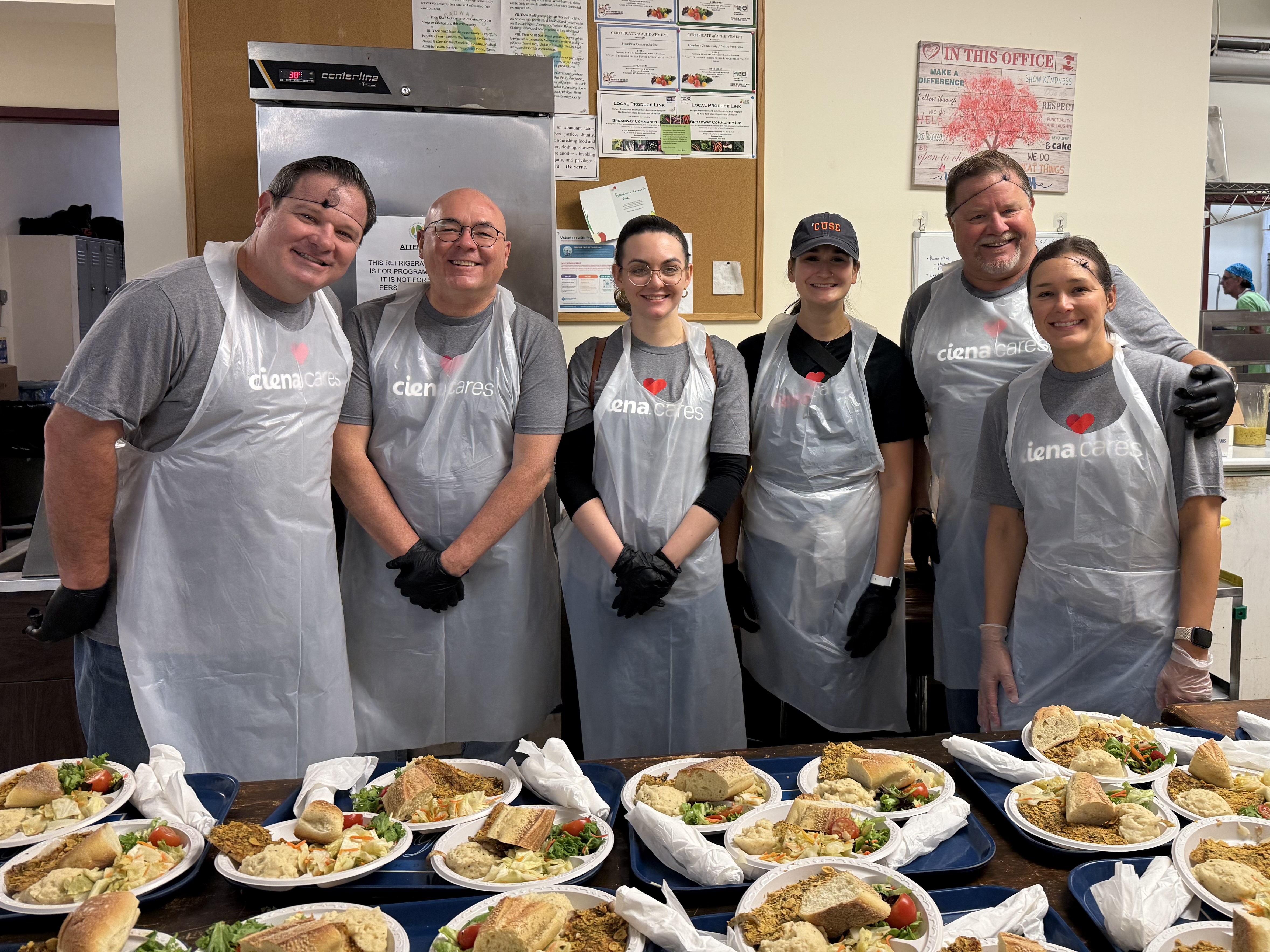 Employees volunteer in a soup kitchen