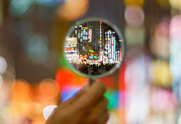 Image of a city close up through a magnifying glass