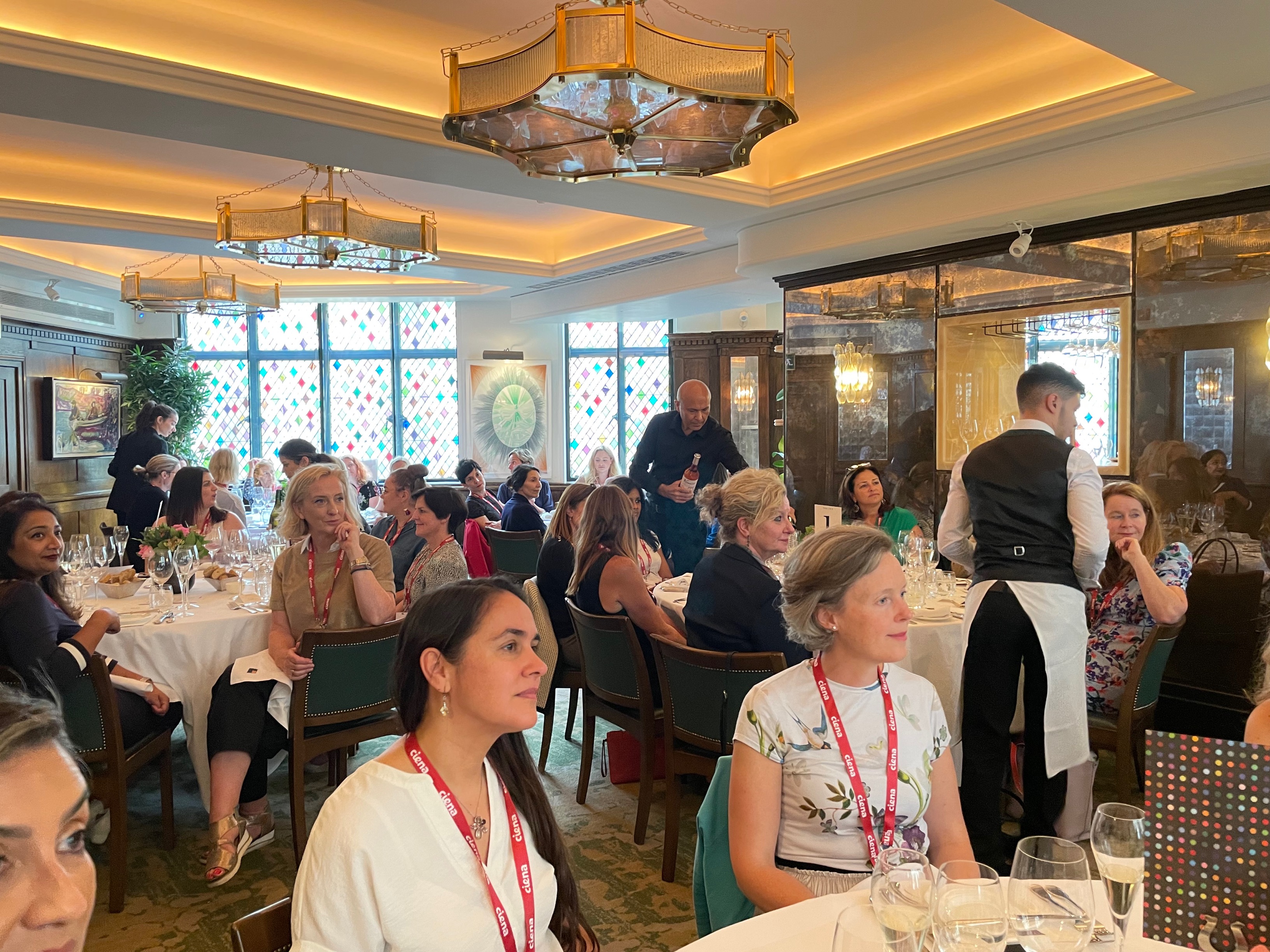 Large group of women sitting at tables 