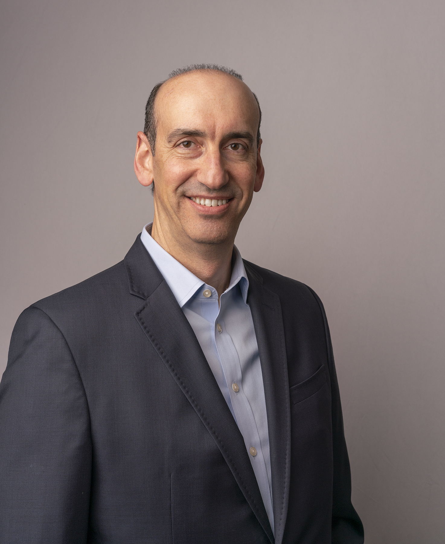 Headshot image of man smiling 