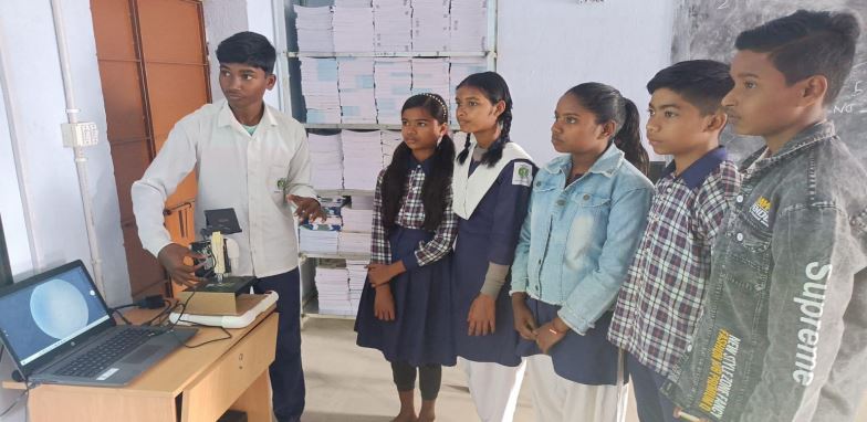 Students using a microscope 