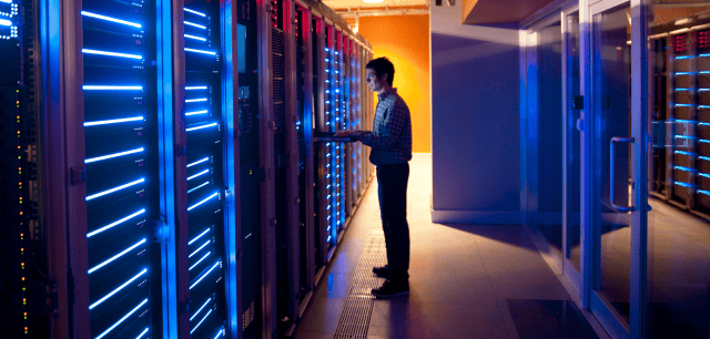 a man standing in a data center
