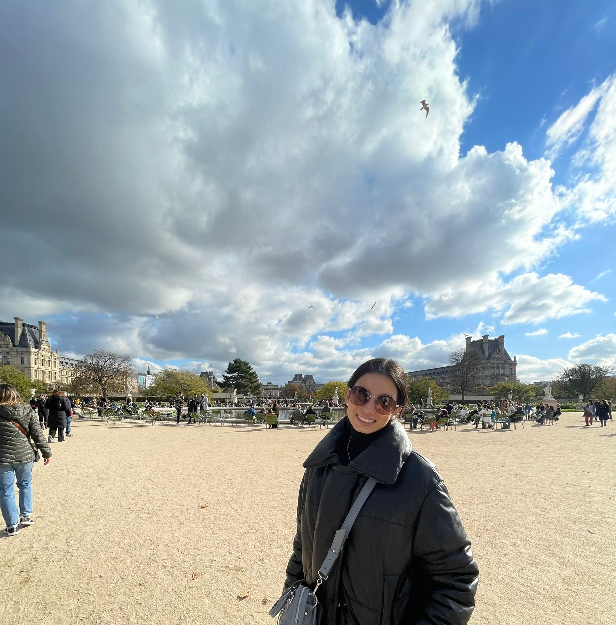 Girl smiling while standing on a beach 