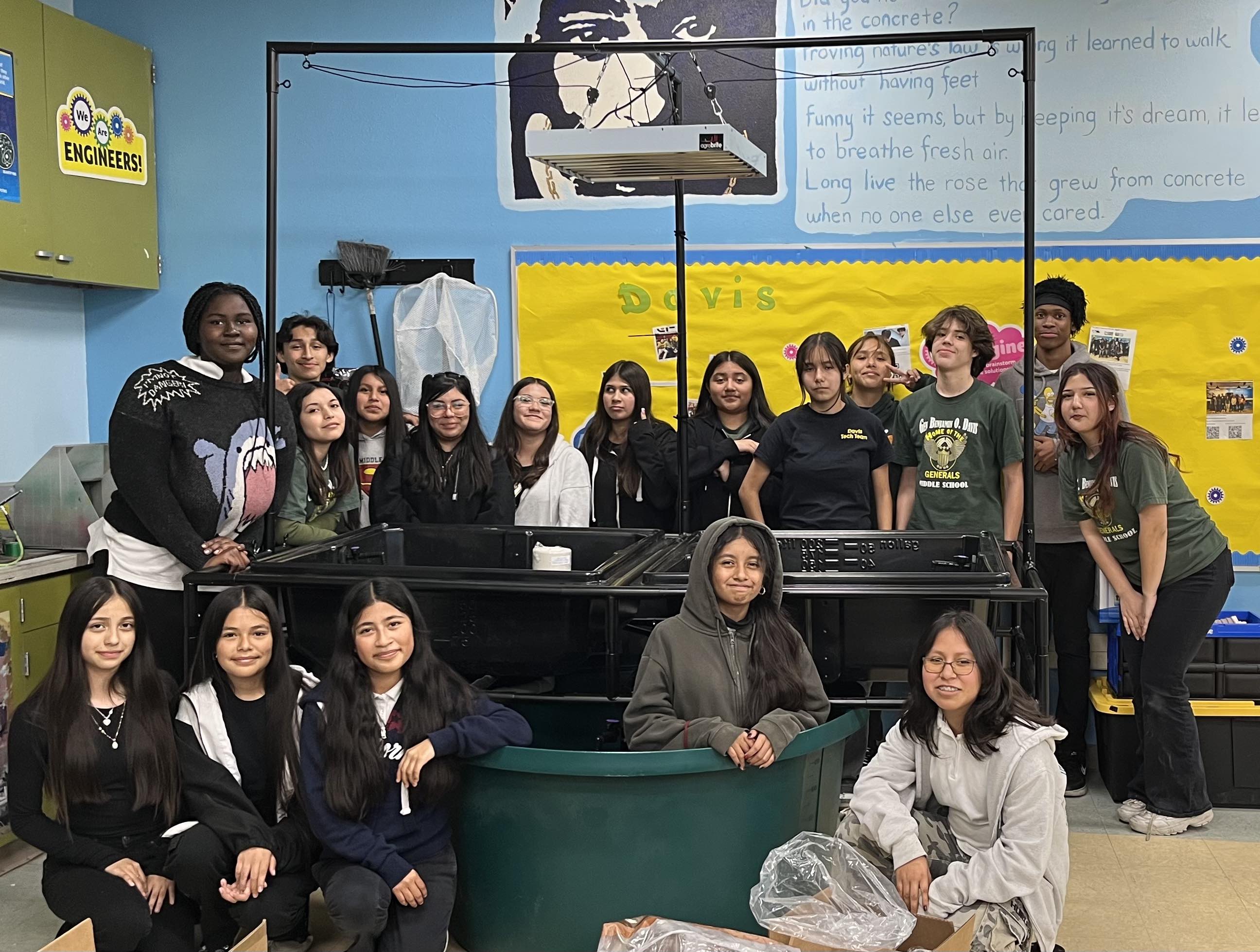 Students pose with their aquaponics system