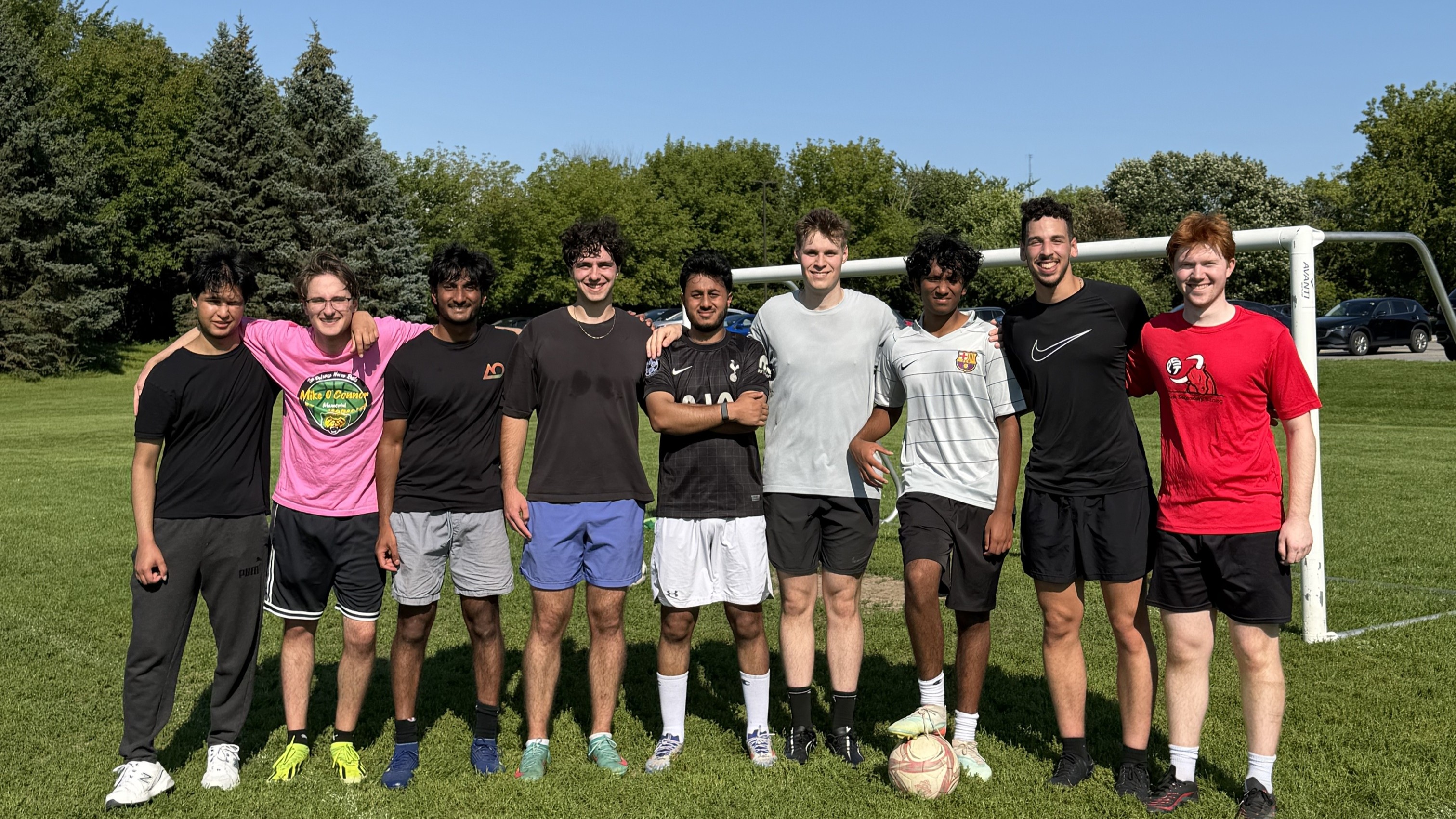 A group of interns in Ottawa playing soccer together